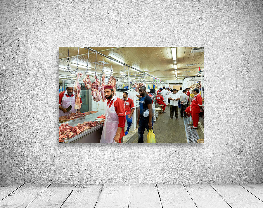 Butchers work at a busy meat market in Dubai UAE preparing fresh Wall Preview