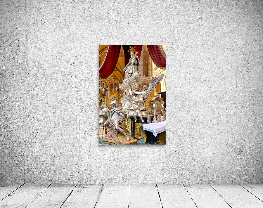 Ornate silver religious monument inside a grand cathedral. Wall Preview