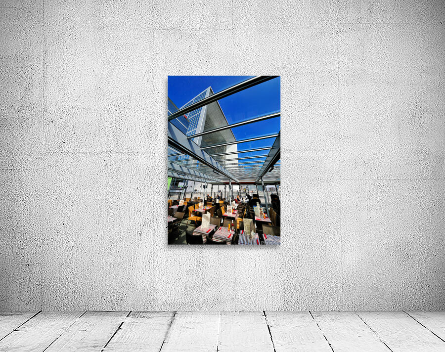 Dining area in Paris with modern building under clear sky Wall Preview