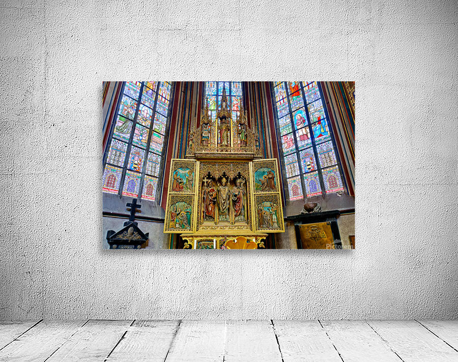 Ornate golden altarpiece and vibrant stained glass windows in a  Wall Preview