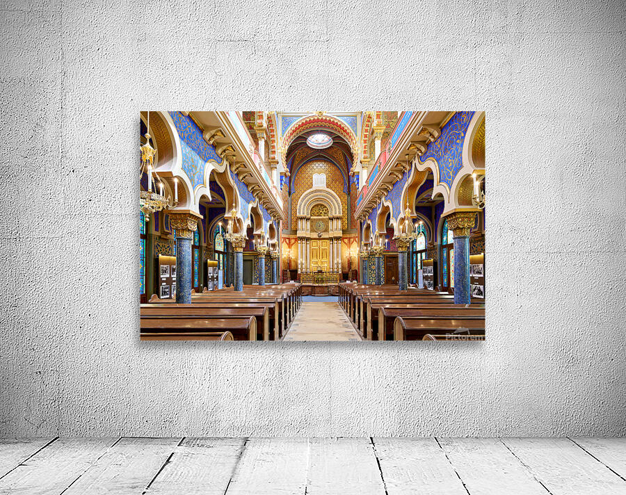 Grand ornate synagogue interior featuring golden ark and pews. Wall Preview