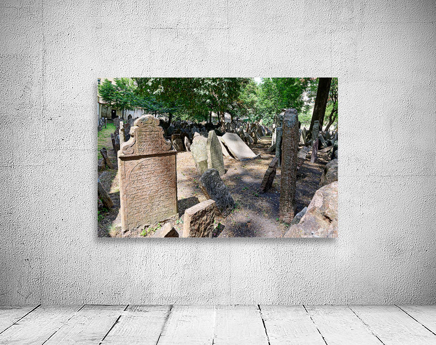 Ancient Jewish cemetery with weathered gravestones and trees. Wall Preview