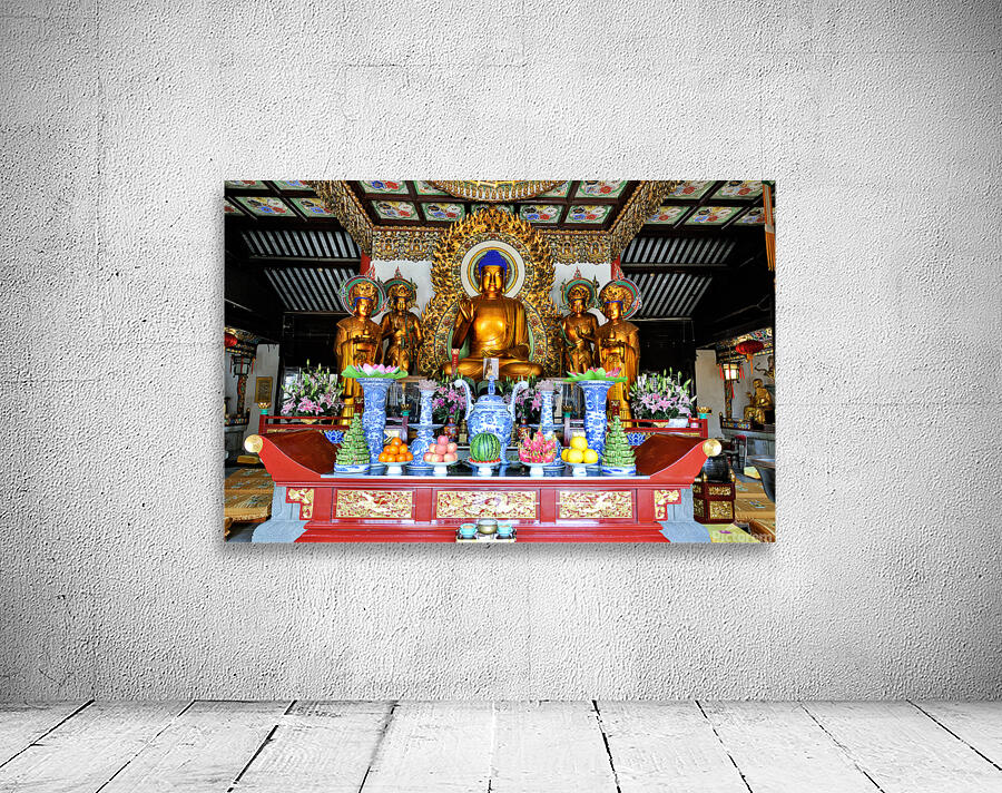Visitors observe golden statues in Shanghai Buddhist temple inte Wall Preview