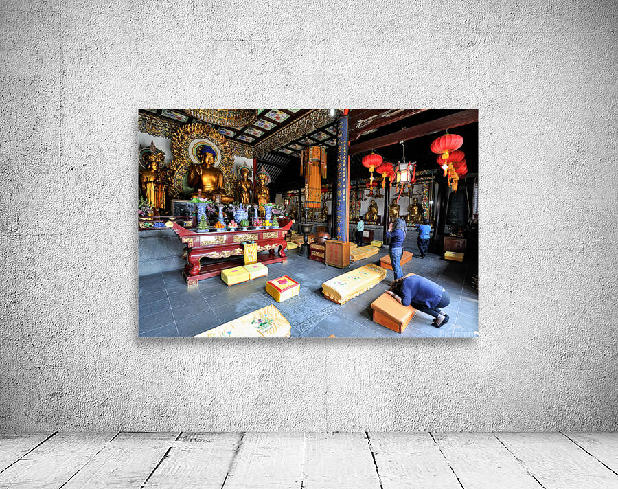 Worshippers offer prayers in a Buddhist temple in Shanghai Chin Wall Preview