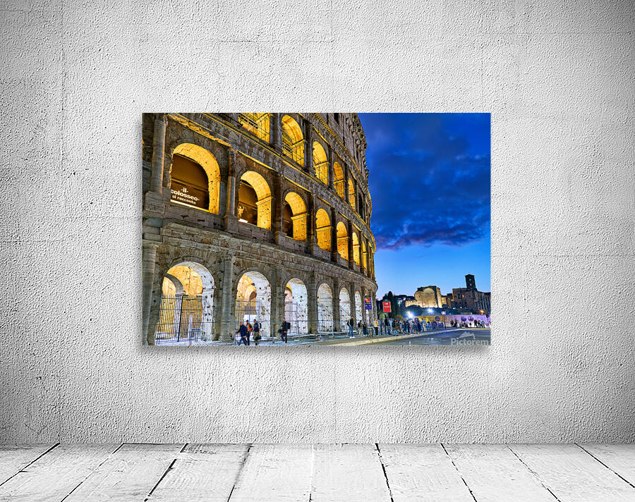 Visiting Colosseum in Rome during twilight hours Wall Preview