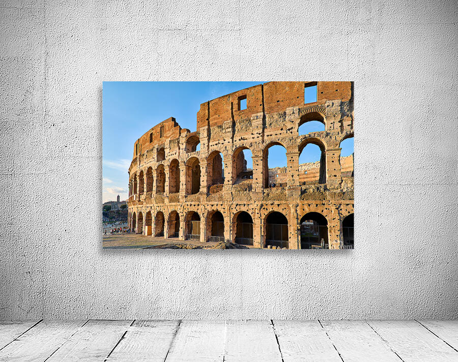 Colosseum stands tall in Rome during golden hour Wall Preview