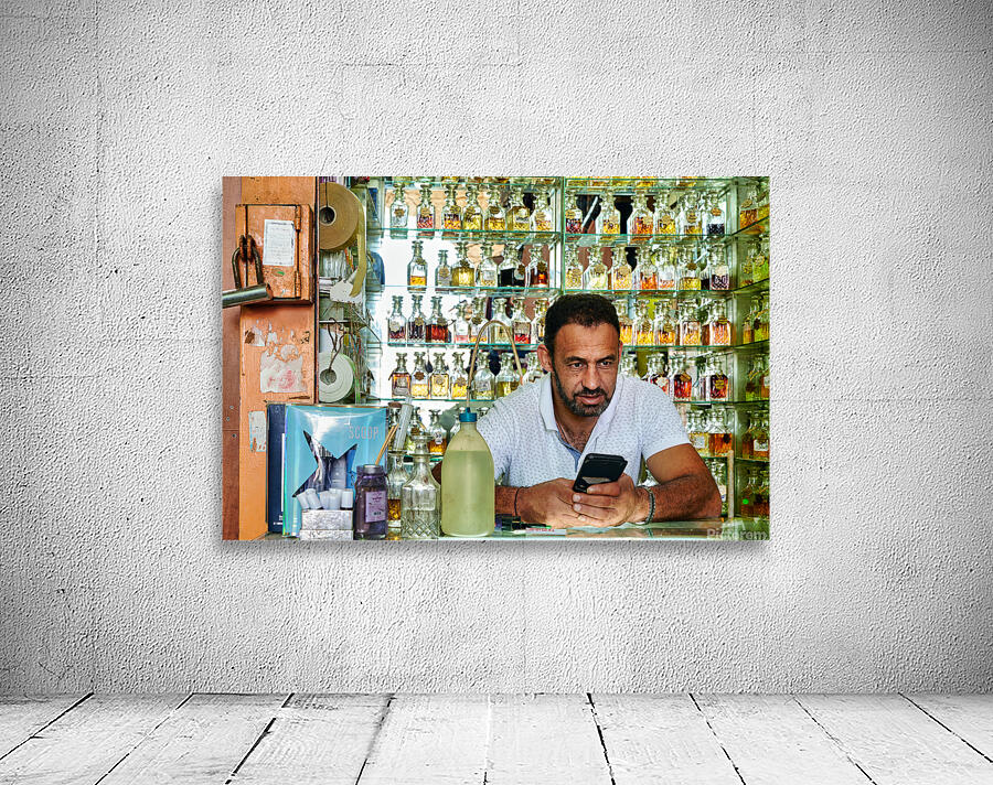 Man working in a perfumery in the old city of Jerusalem Wall Preview
