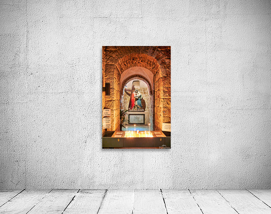 Statue of Mary and Jesus in a chapel with candles Wall Preview