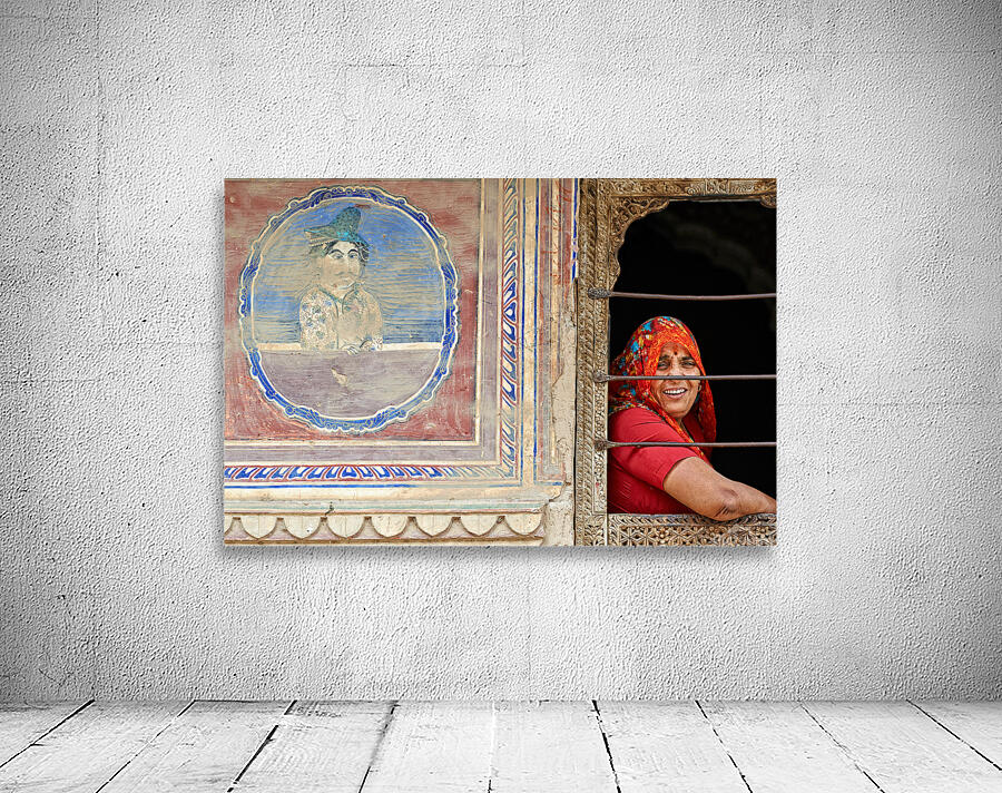 Woman smiles while looking out of a window in Mandawa Rajasthan Wall Preview