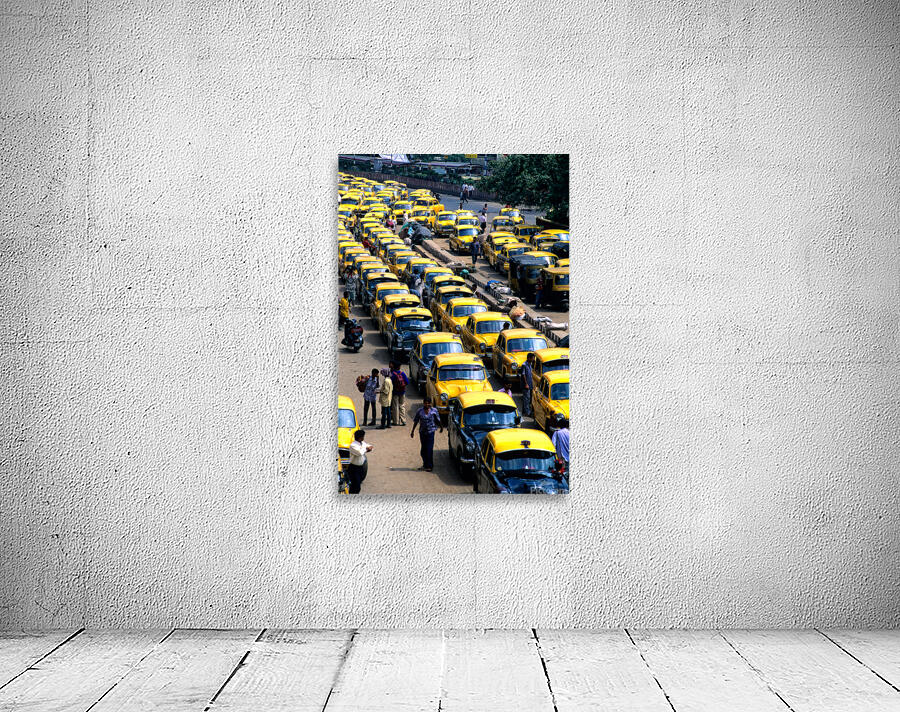 Taxi parking in Kolkatas busy streets during daytime Wall Preview