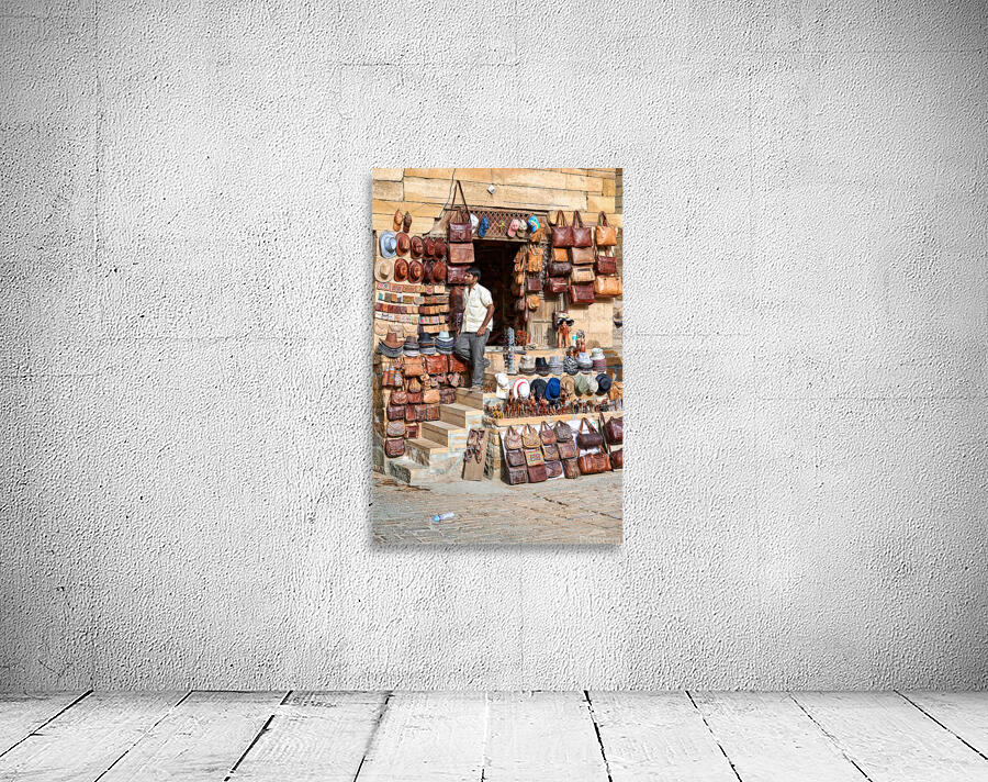 Selling leather bags in Jaisalmer from a shop Wall Preview