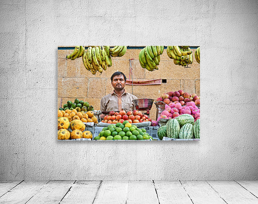 Fruits and vegetables stall in Jaisalmer with vendor at work Wall Preview