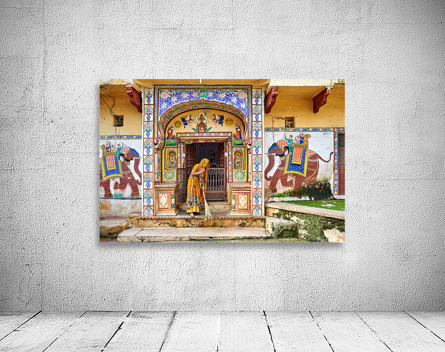 Bundi Rajasthan house with painted walls and a woman sweeping Wall Preview