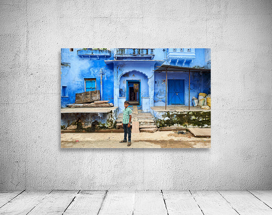 Decorated painted house in Bundi with a boy standing outside Wall Preview