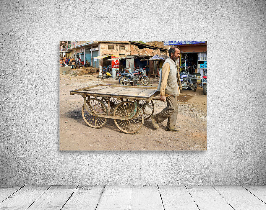 Man pulls an empty cart in Orchha Madhya Pradesh India Wall Preview