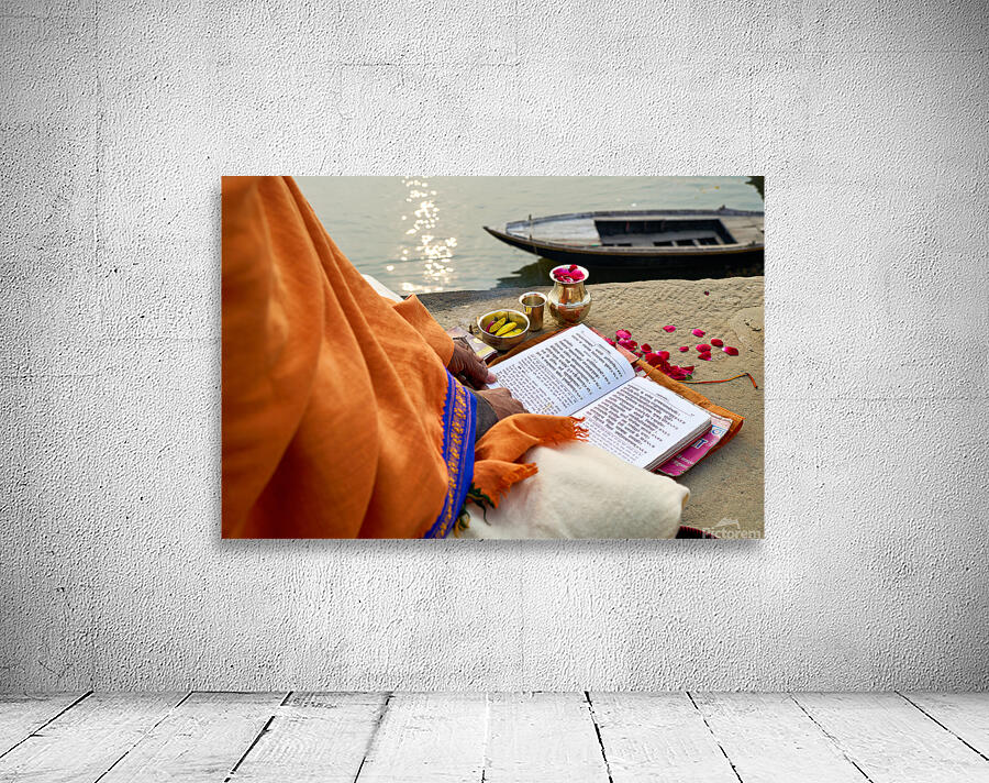 Praying by the ganges river in varanasi india Wall Preview
