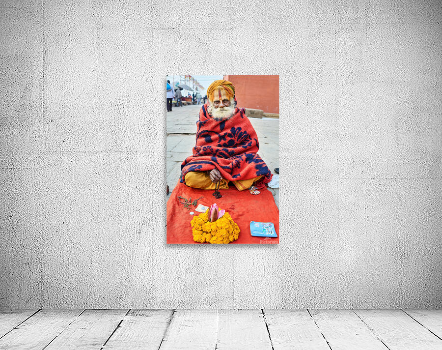 Holy man sadhu sits with offerings in Varanasi Uttar Pradesh Wall Preview
