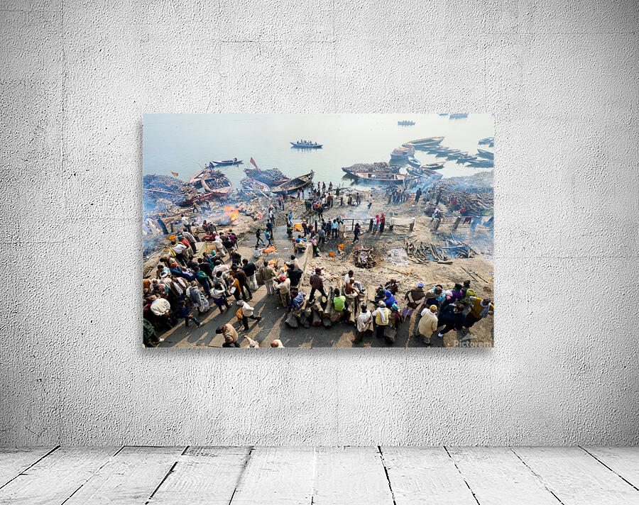 Cremation rites by the river Ganges in Varanasi India Wall Preview