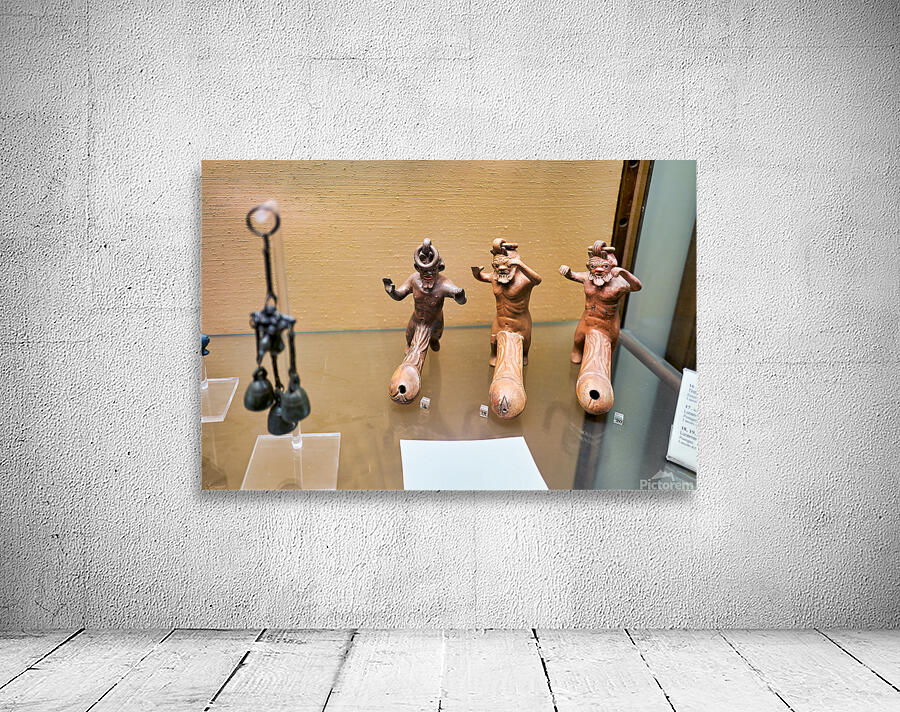 Displays of ancient artifacts are shown in glass cases Wall Preview