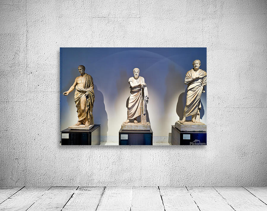 Statues of ancient philosophers displayed in museum setting Wall Preview