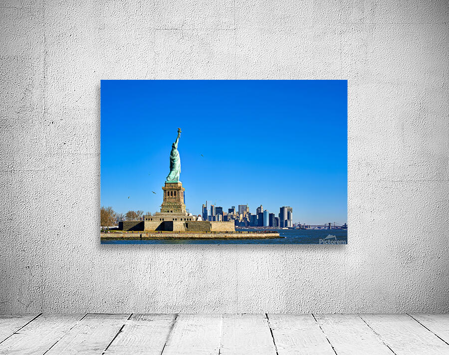 Statue of Liberty stands tall on Liberty Island in New York City Wall Preview