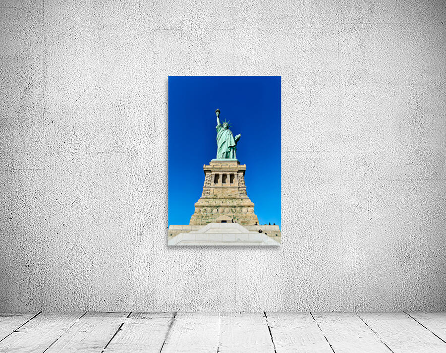 Statue of Liberty stands proudly on Liberty Island in Manhattan Wall Preview