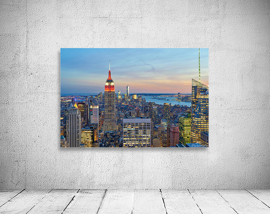 Manhattan aerial view showing Empire State Building at sunset Wall Preview
