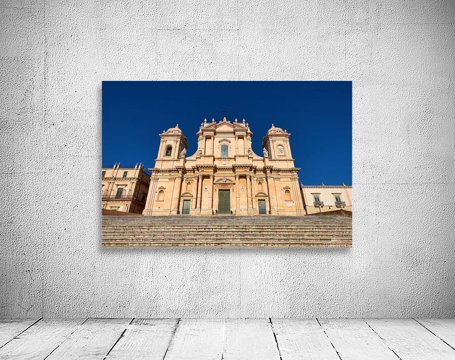 Noto Cathedral stands tall in Sicily under a clear blue sky Wall Preview