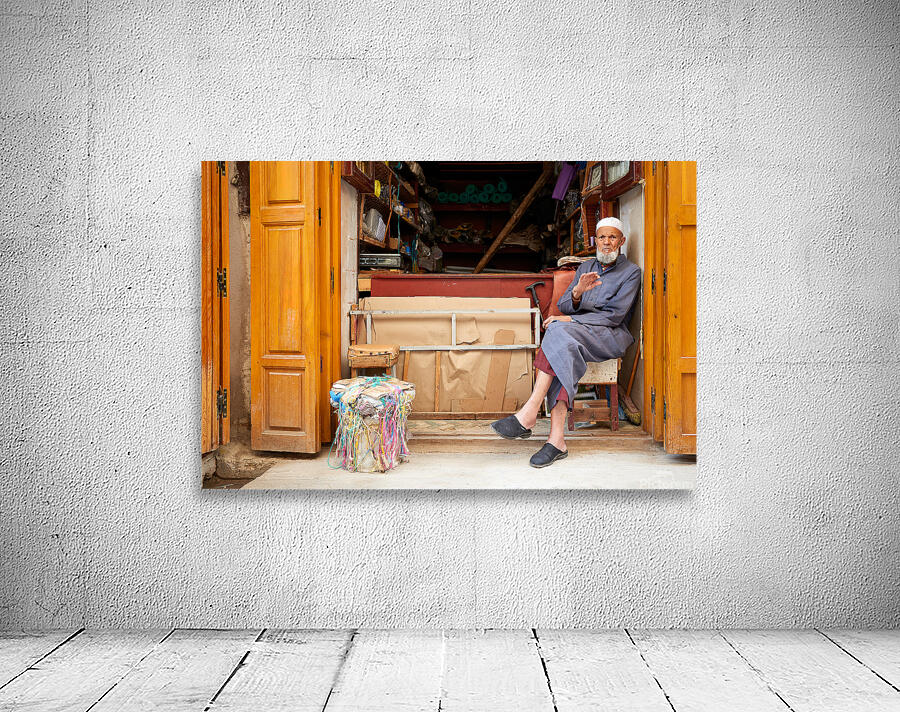 Old man in second hand shop at medina in Fez Morocco Wall Preview