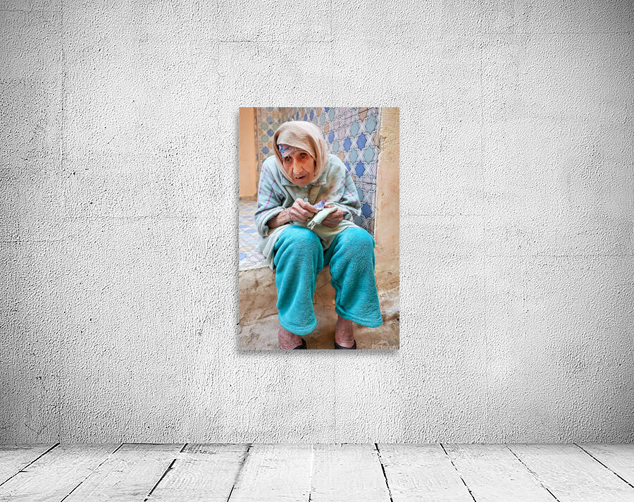 Beggar sitting in Fez Morocco with worn clothes and hands Wall Preview