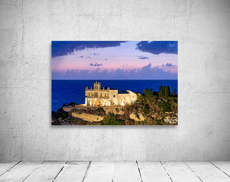 Tropea offers views of the sea and buildings at sunset in Calabr Wall Preview
