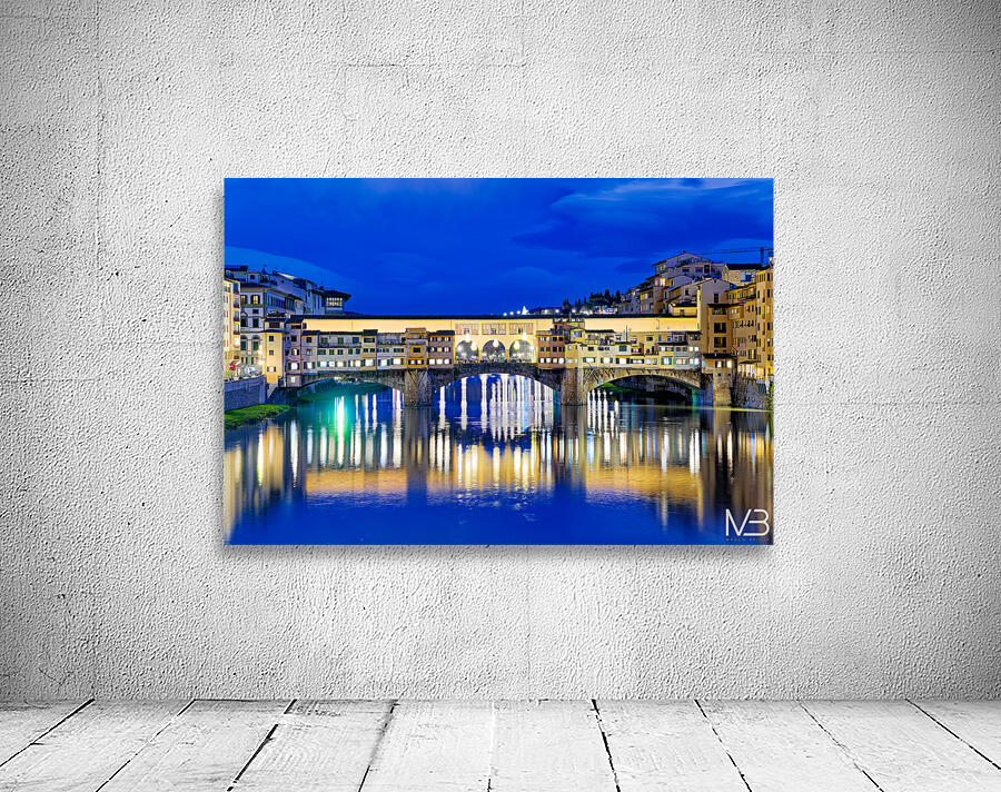 Ponte Vecchio bridge in Florence under evening sky over river Ar Wall Preview