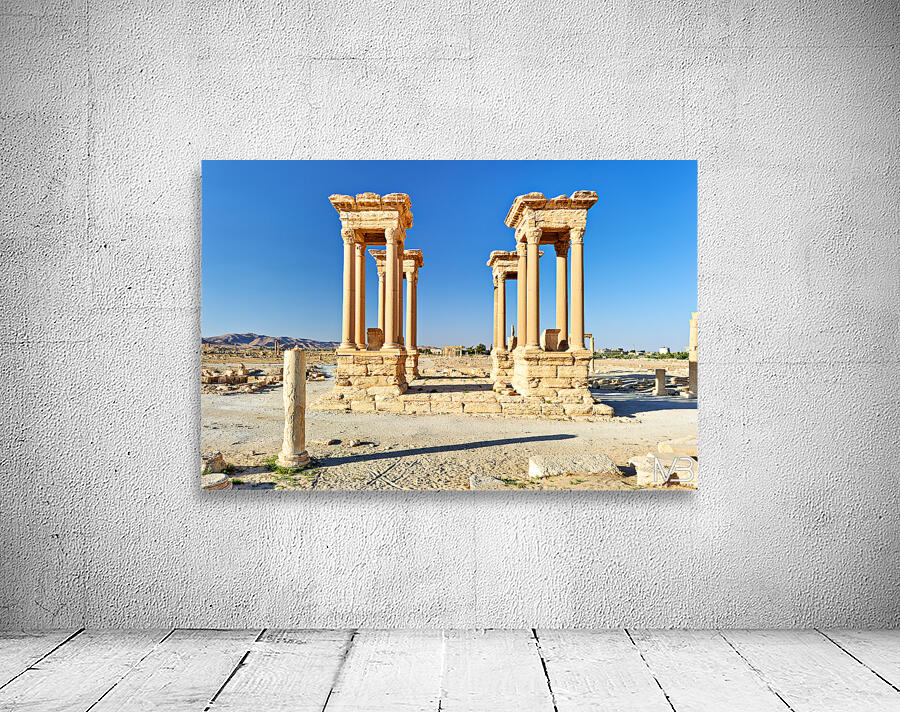 Exploring the Tetrapylon at Palmyra in Syria during the day Wall Preview
