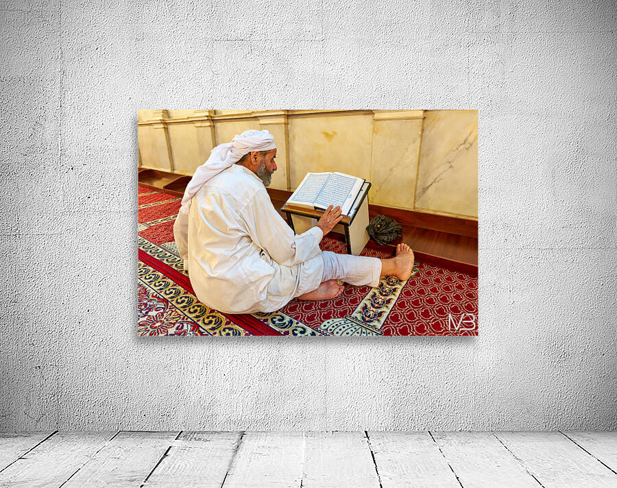 Elderly man reading Quran inside Umayyad Mosque in Damascus Syri Wall Preview