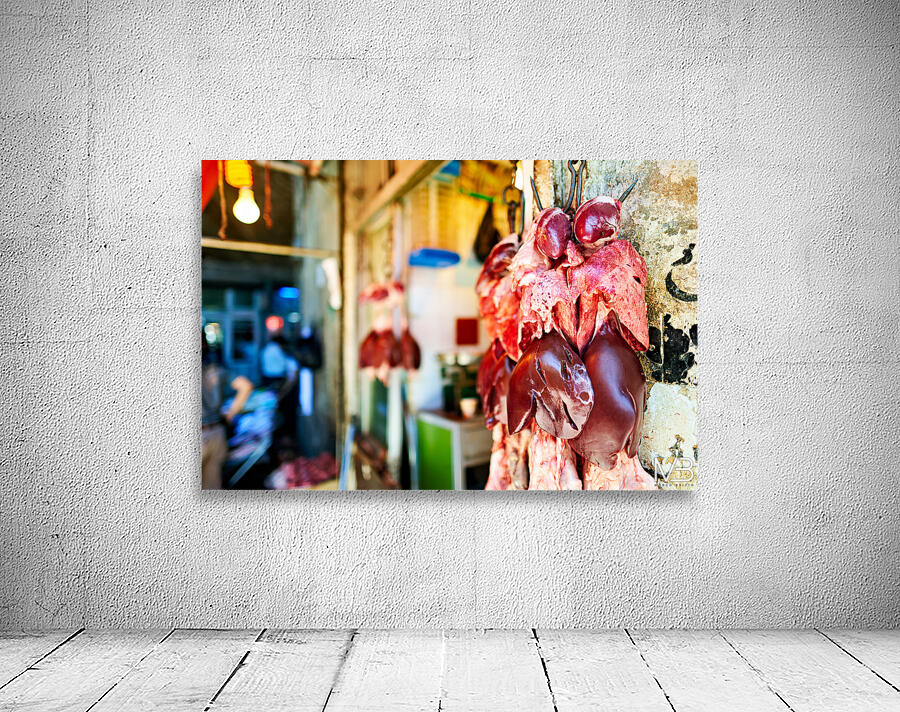 Butcher displays meat at souq in Aleppo Syria during the day Wall Preview