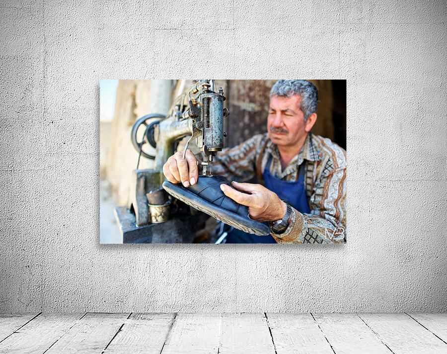 Shoemaker working in Aleppo souq in Syria Wall Preview