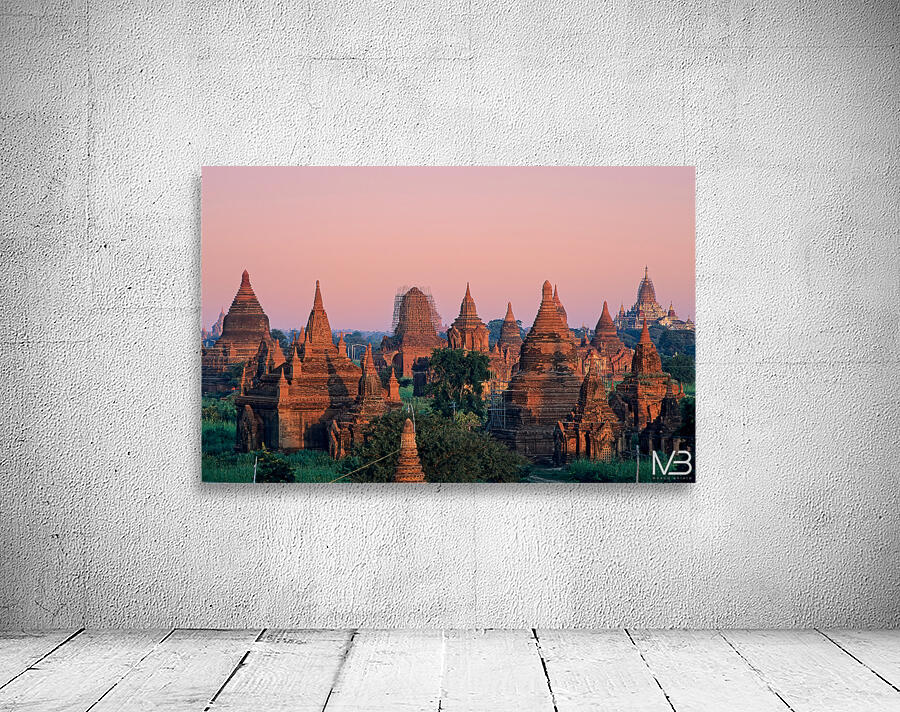 Temples in Bagan at dusk with a clear sky over Myanmar Wall Preview
