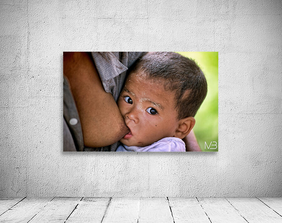 Feeding a baby in Myanmar during daytime hours Wall Preview