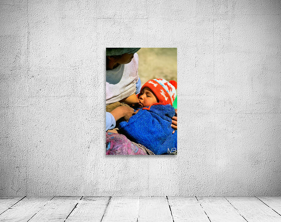Indigenous mother nourishes child in the Andes of Argentina Wall Preview