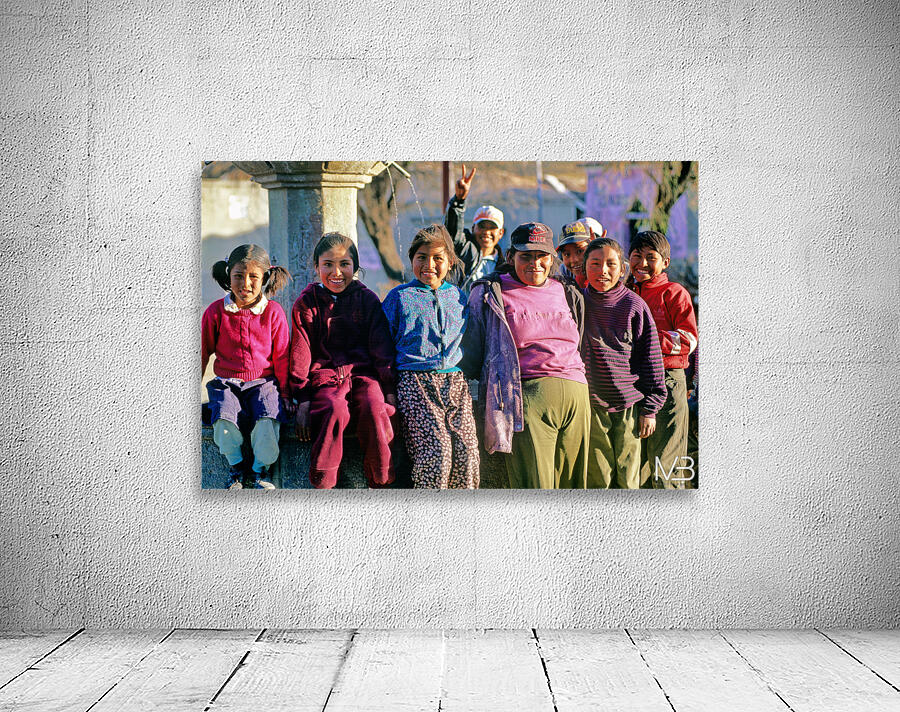 Smiling children and youth gather by a fountain. Wall Preview