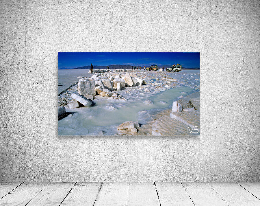 Explorers on a salt flat with salt blocks and water. Wall Preview