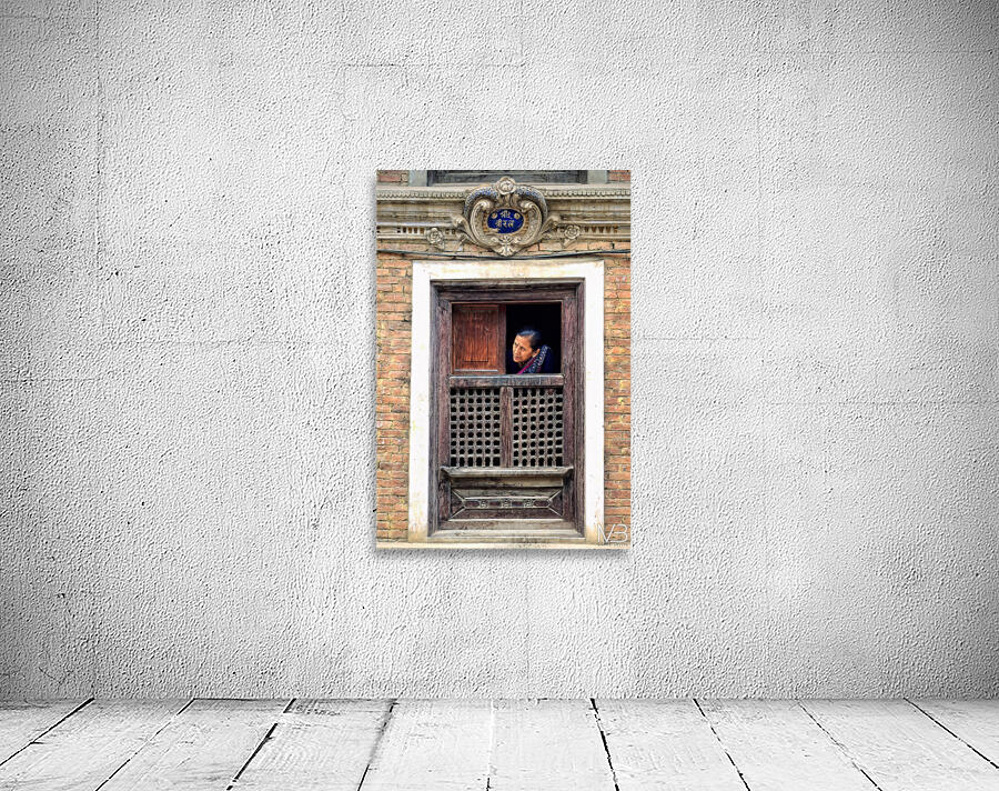 Woman in Kathmandu looks out from window in old building Wall Preview