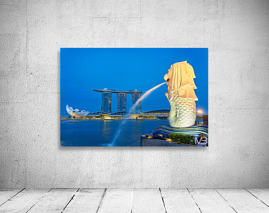 Visitors watch the Merlion fountain at Marina Bay during sunset Wall Preview