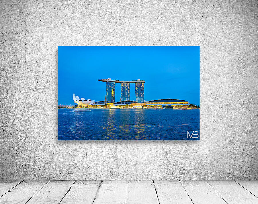 City skyline at sunset over Marina Bay with reflections on water Wall Preview