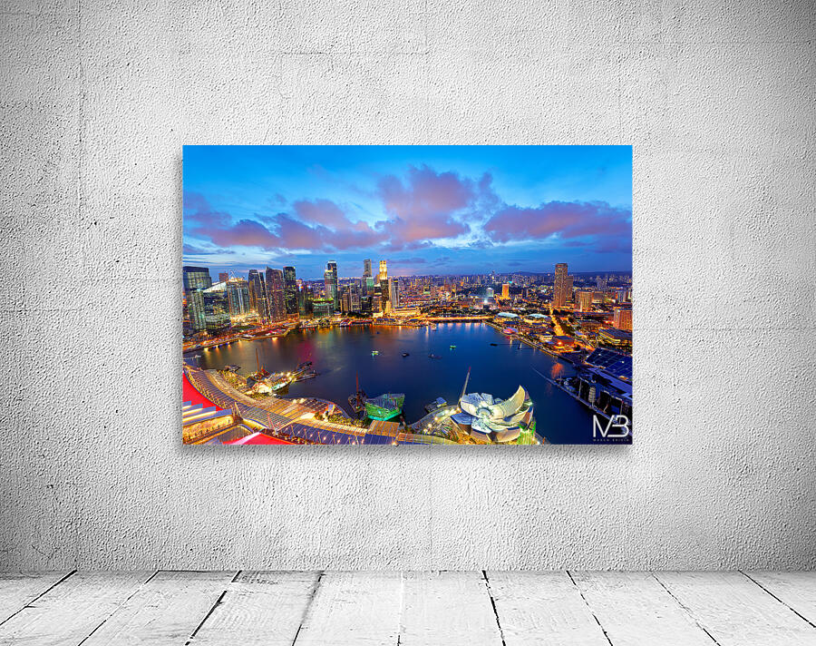 City lights shine over Marina Bay in Singapore at sunset Wall Preview