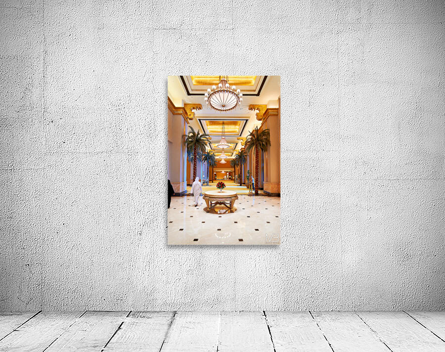 Visitors stroll through Emirates Palace Hotel lobby Wall Preview