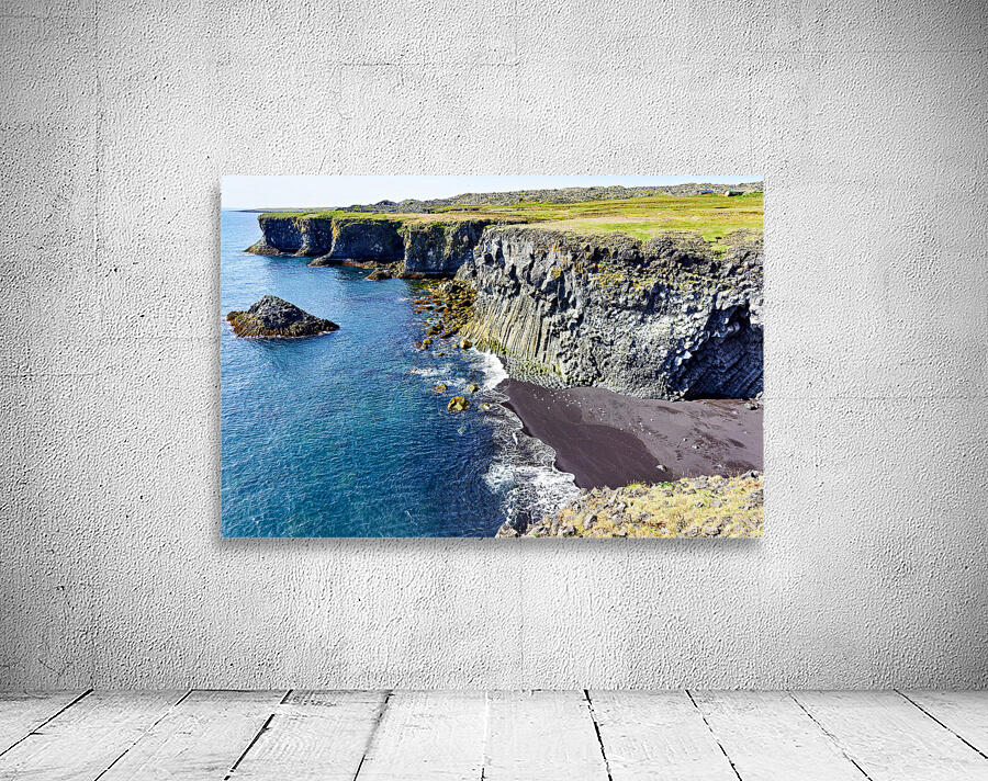 View of Arnarstapi cliffs and black sand beach in Iceland Wall Preview