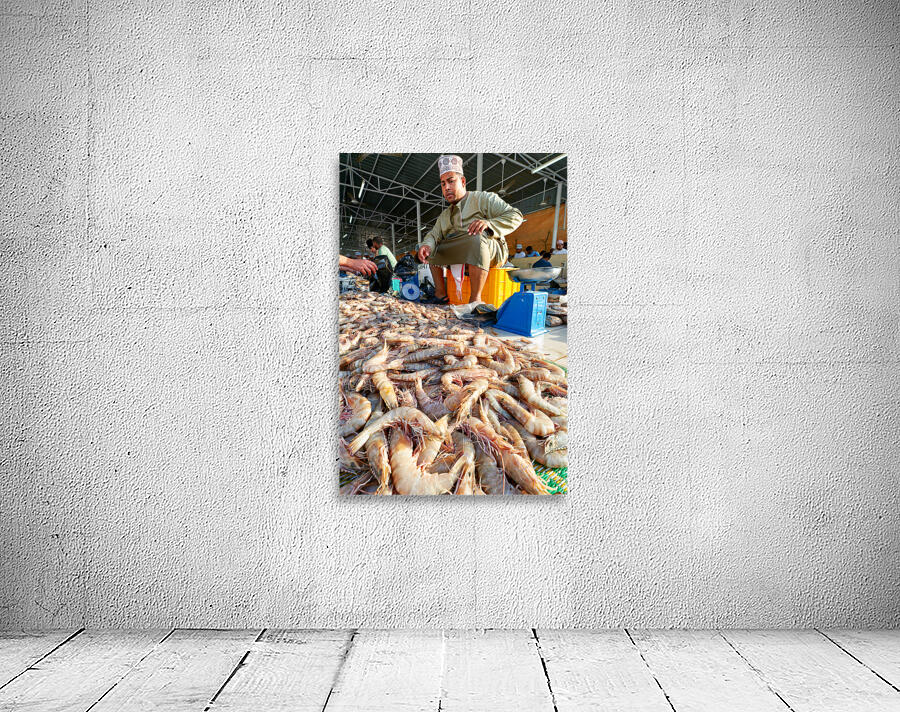 Fish market in Muscat Oman shows vendor and fresh catch Wall Preview