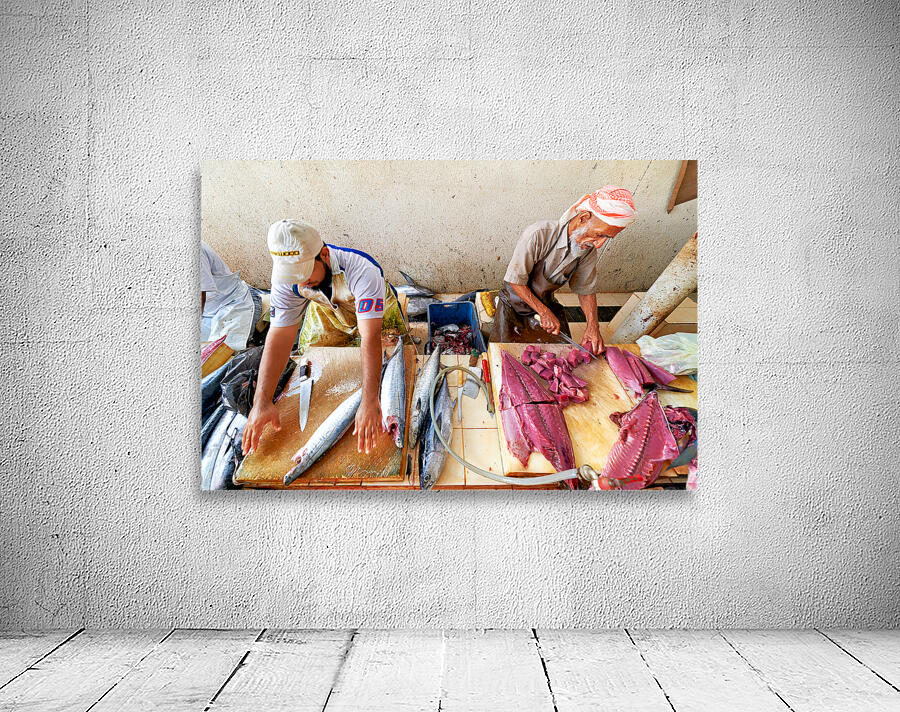 Fish market in Muscat Oman shows workers preparing fish Wall Preview