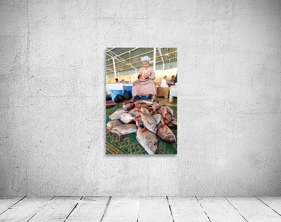 Man sells fresh fish at Muscat Oman fish market today Wall Preview